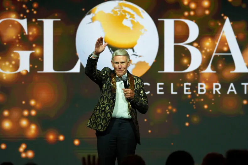 Graeme Clegg receiving the Lifetime Achievement Award at the DSN Global 100 Celebration