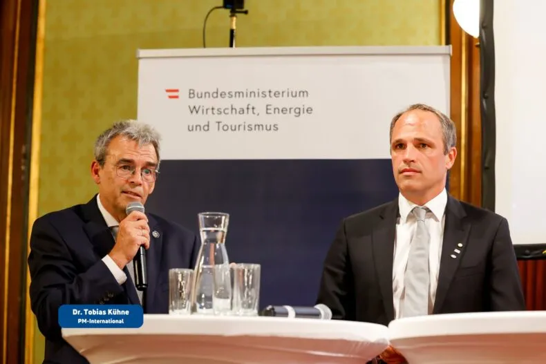 PM-International's Dr. Tobias Kühne speaks, alongside Prof. Dr. Weghuber Julian