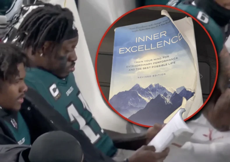 AJ Brown of the Philadelphia Eagles reading "Inner Excellence" book by Jim Murphy at NFL Playoff Game in 2025
