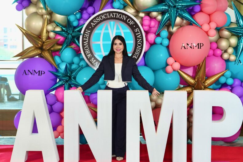 Karen Centeno smiles for a welcoming photo at ANMP 2026