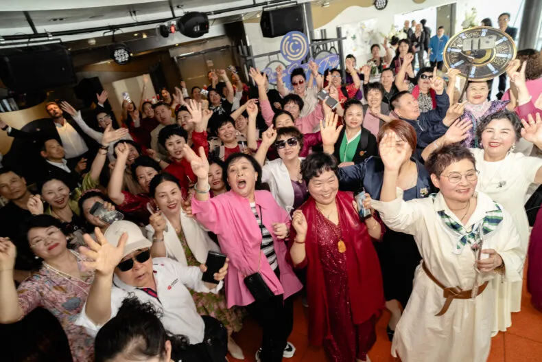C1 crowd waving and cheering during a recognition moment