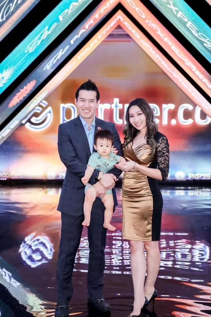 James and Becky Zheng with their family after advancing to Chairperson 4 at Partner.Co