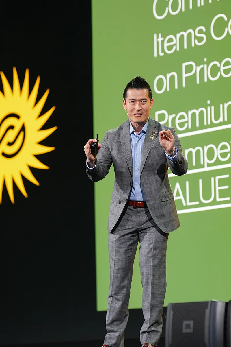 James Zheng presenting on stage during a Partner.Co leadership conference