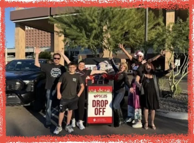 APLGO associates participating in a holiday donation drop-off for community giving initiatives