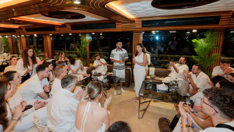 BE leaders conducting a mastermind training session aboard a yacht during the Dubai Sapphire Retreat.