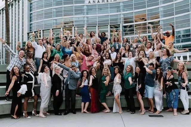 Dr. Dana McGrady with a large group of women leaders and entrepreneurs outside the Anaheim Convention Center, celebrating the Amare Global women’s wellness and wealth movement.
