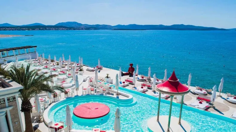 Terrace and private beach club with ocean views at the DreamTrips Croatia resort