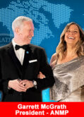 Garrett McGrath, President of the ANMP, smiling and standing with a guest during the ANMP International Convention.