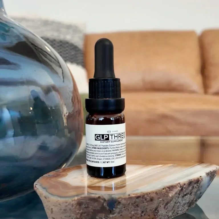 GLP THREE dietary supplement bottle displayed in lifestyle setting