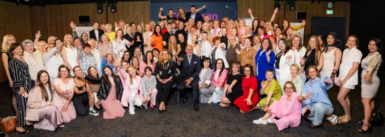 Large group photo of Greenway partners and leaders posing at a European Tour event.