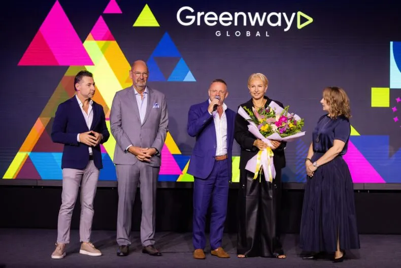 Leonid Morgunov speaking on stage with Greenway Global leadership team during the Croatia Forum 2025.