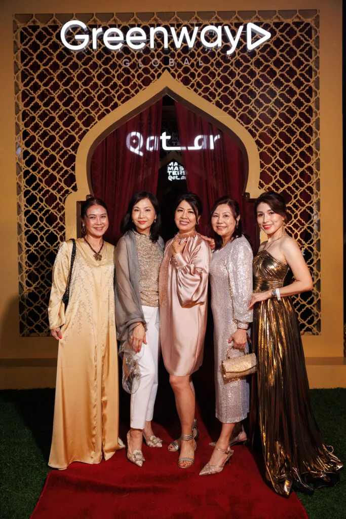 Group photo of Greenway Global partners dressed in formal attire at the MaxMasters Qatar gala