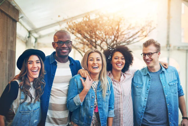 Group of friends laughing together during a social gathering