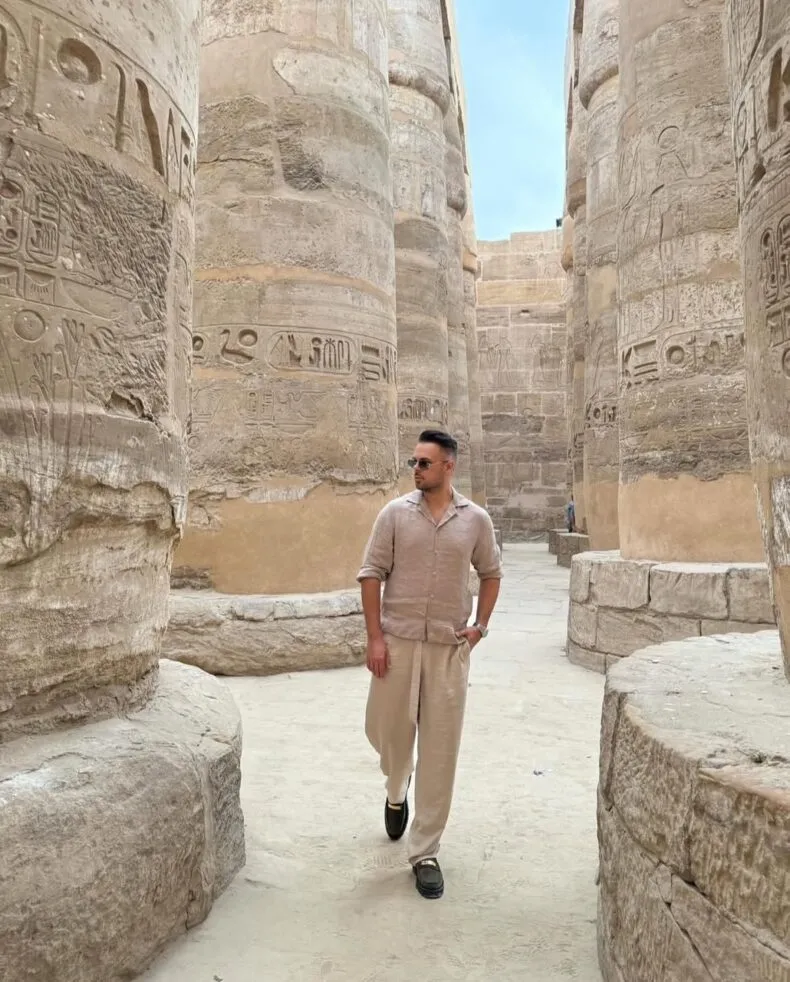 Ivan Martinec, Zinzino Royal Ambassador, walking in a Temple in Egypt, symbolizing his global reach and leadership journey.
