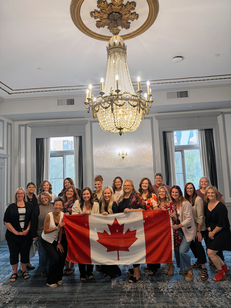 Laura Bangar with members of her Bravenly Global team in Canada