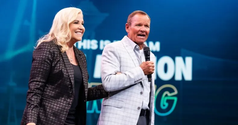 Matt and Kim Curtis speak on stage at a LifeWave event after achieving Elite Status.