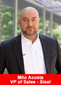 Milo Acosta, VP of Global Sales at Sisel International, in a white shirt and black blazer, standing outdoors.