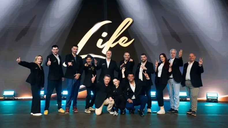 MWR Life corporate team on stage