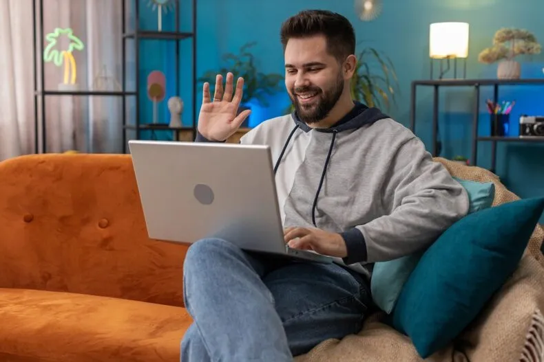 Network marketer experiencing burnout while working on laptop