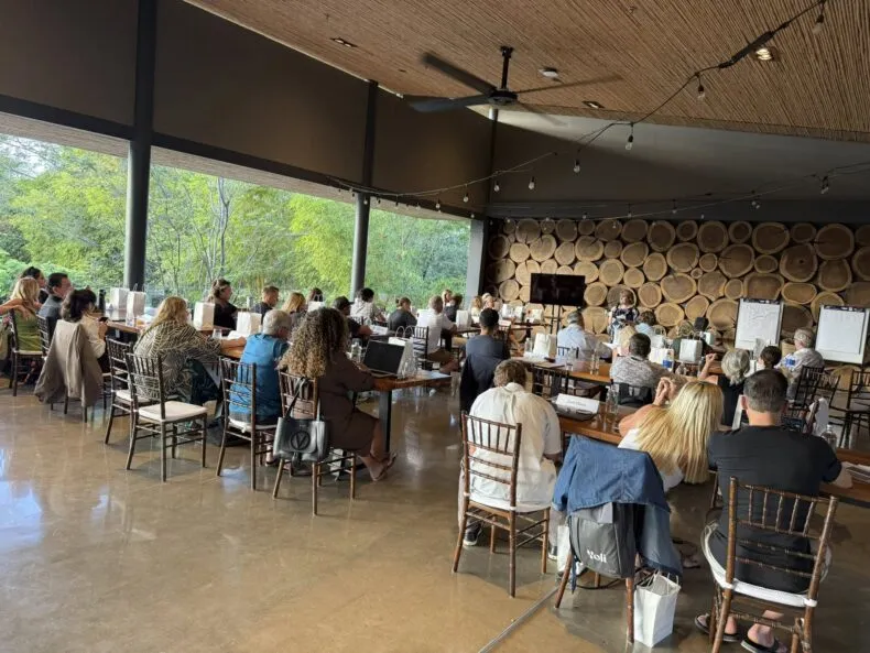 Network marketing leaders engaged in group learning and discussion during Costa Rica mastermind