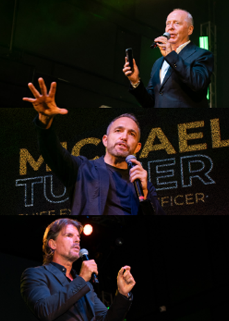 Network marketing leaders speaking on stage during a live leadership presentation