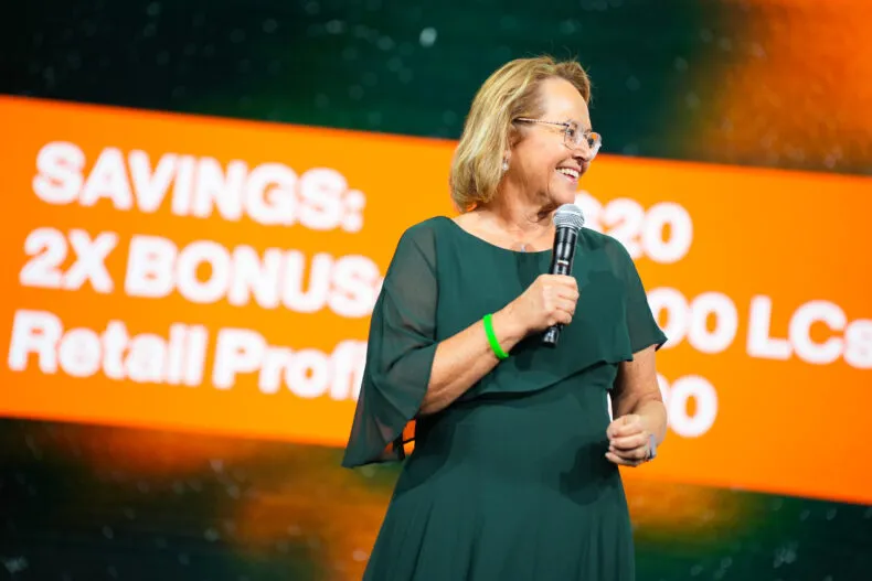 Partner.Co executive speaking during a leadership presentation at a global company event