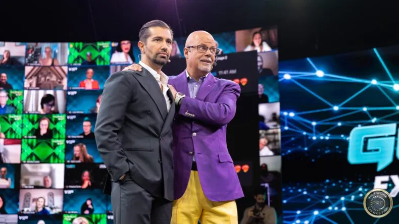 Sandro Cazzato and Eric Worre on stage