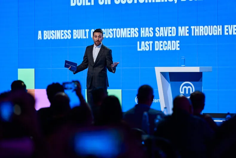 Stefano Orrù addressing the audience during a Mastermind Event presentation