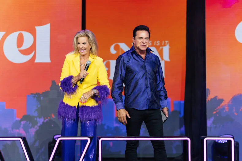 Steve and Gina Merritt on stage hosting the NEXT LEVEL THIS IS IT Convention, leading one of the largest independent team events in network marketing