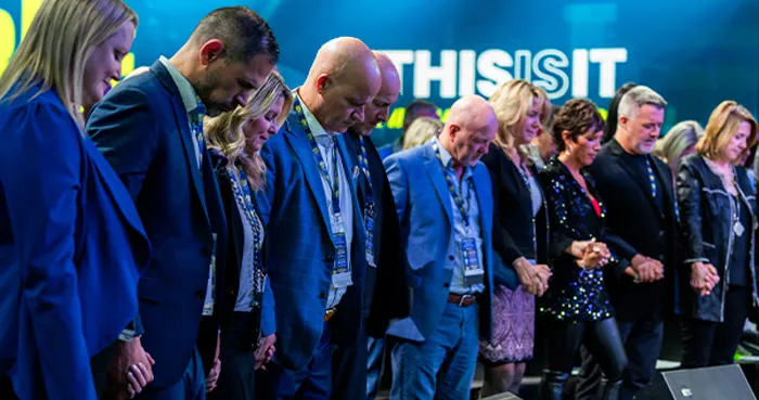 THIS IS IT Team leaders praying together