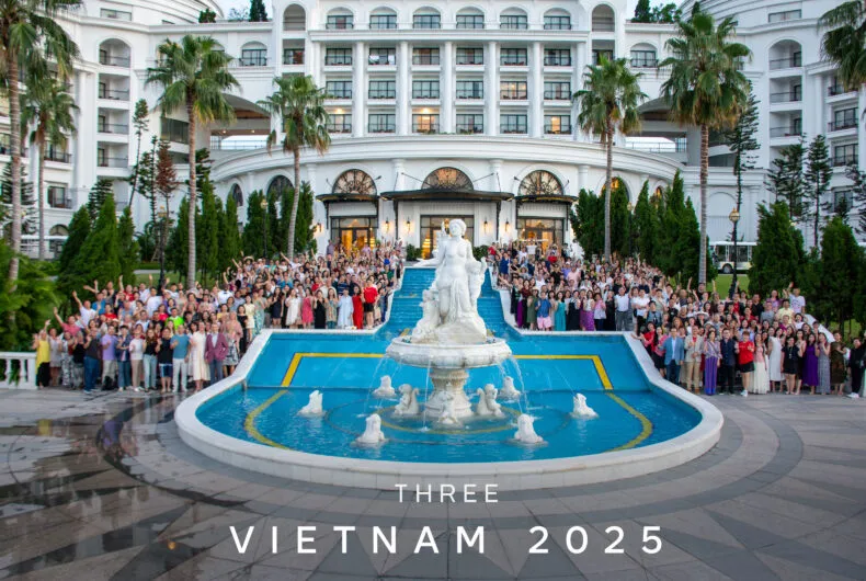 Large group photo of THREE Brand Ambassadors at the Vietnam 2025 incentive trip standing in front of a resort fountain