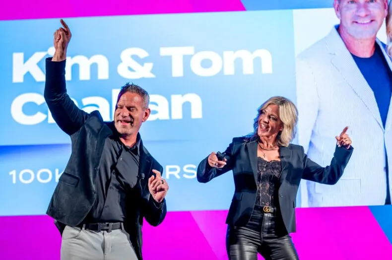 Tom and Kim Challan MWR Life leaders speaking on stage