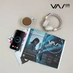 Vyvo AI brochures, smartphone app, and branding materials displayed with coffee and headphones.