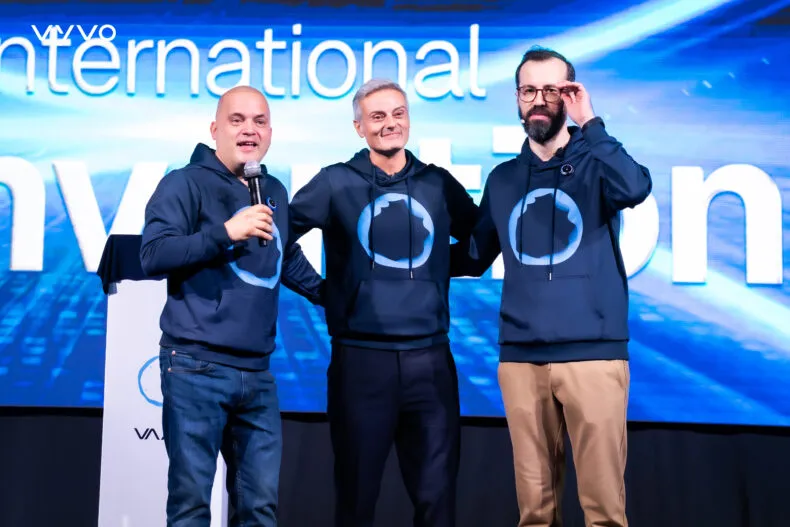 Hakan Kozakli, Fabio Galdi, and Alfonso Cioffi standing together on stage at the Vyvo International Convention 2025