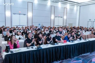Vyvo attendees participate in a formal training session in a conference room.